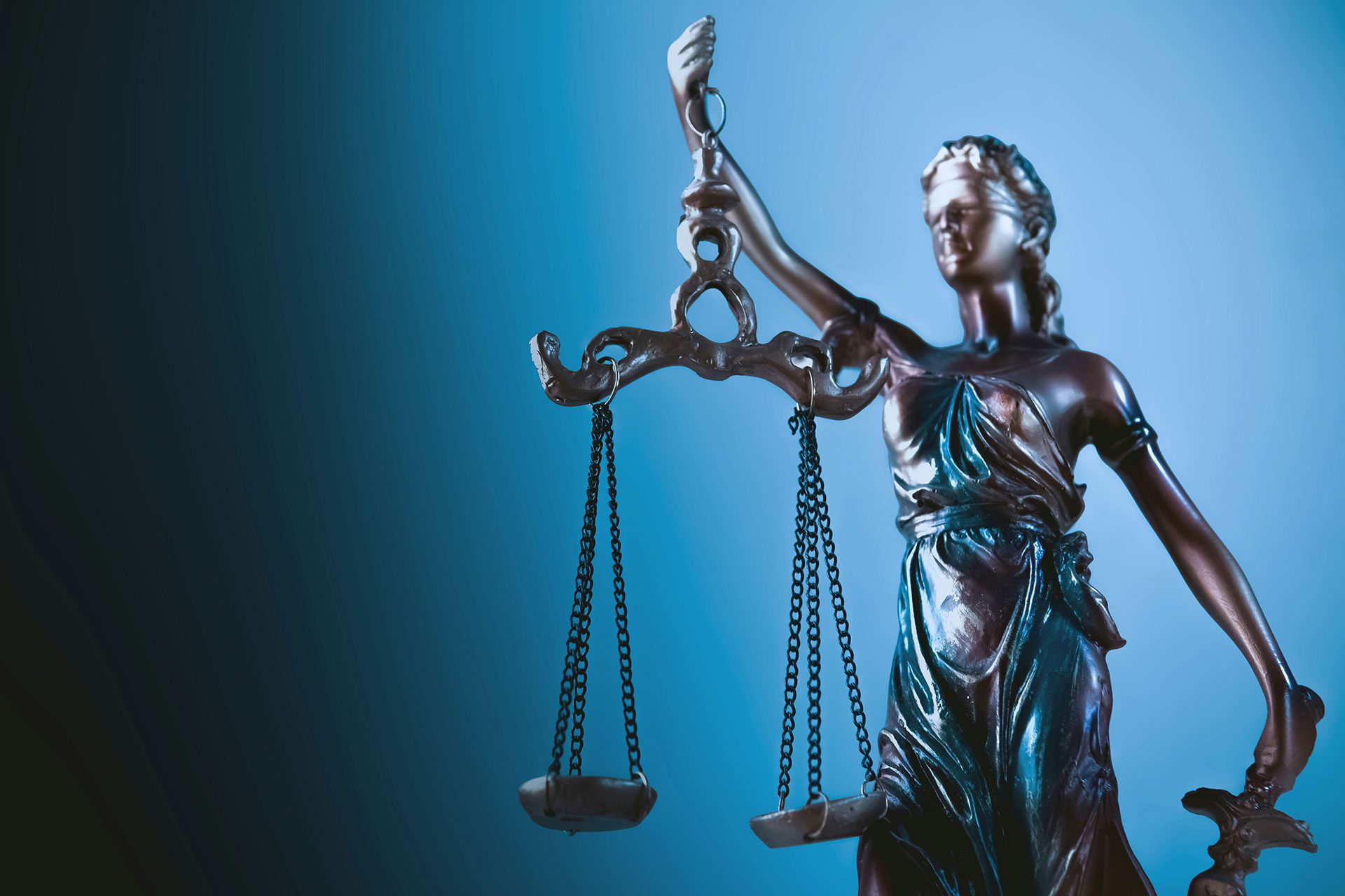Statue of Lady Justice holding scales, symbolising the role of legal protection in safeguarding intellectual property and ensuring long-term business value for SMEs.