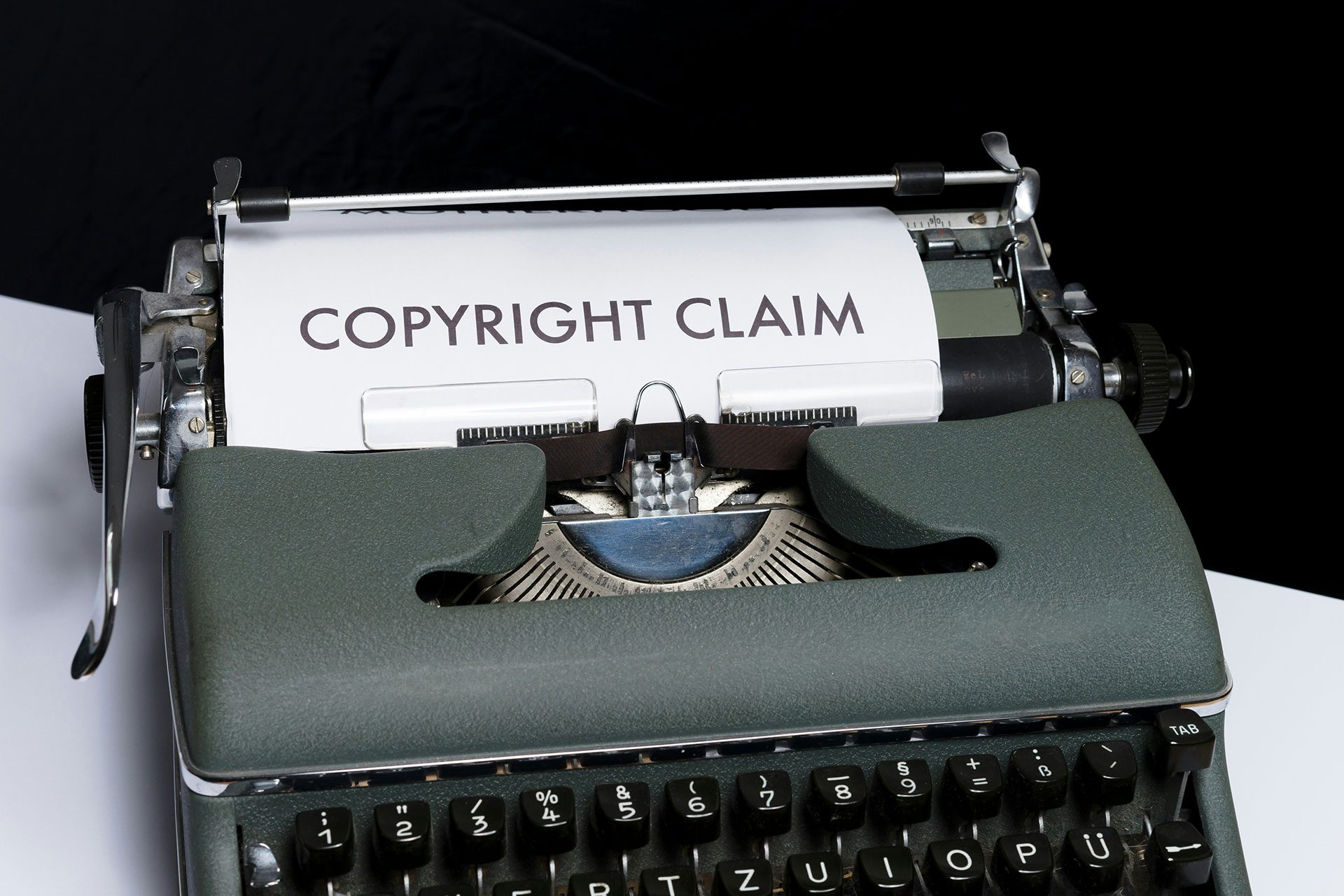 Protecting Intellectual Property for Long-Term Business Value Typewriter displaying the words copyright claim, representing the importance of protecting intellectual property to build scalable, defensible, and transferable business assets.
