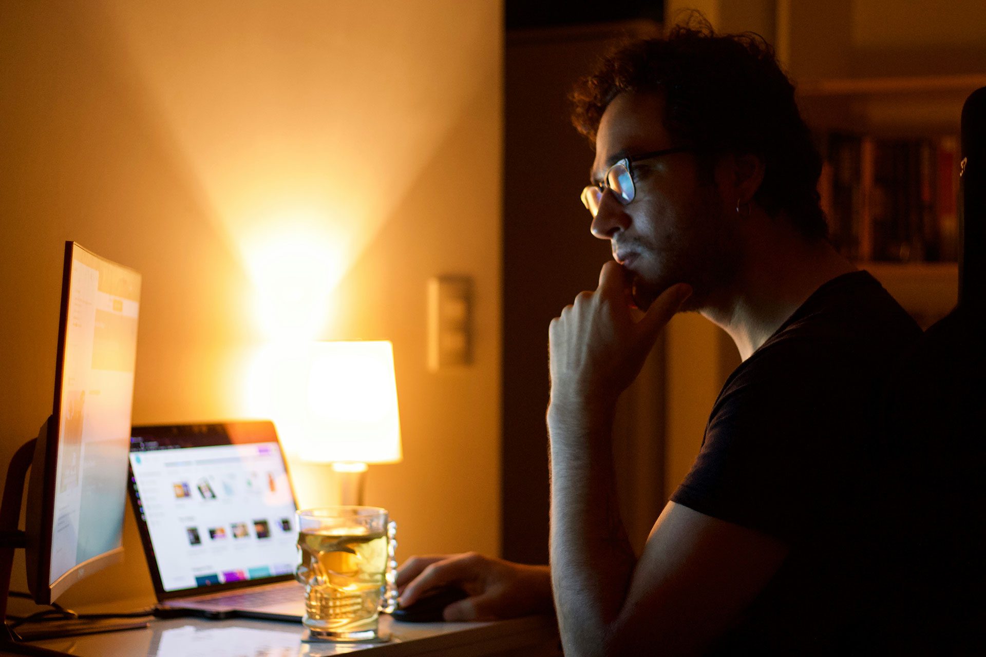 The Late-Night Reality of Founder Dependency Entrepreneur working late at night alone at a desk, looking focused yet fatigued, representing the hidden stress, long hours, and operational pressure of running a founder-led business.